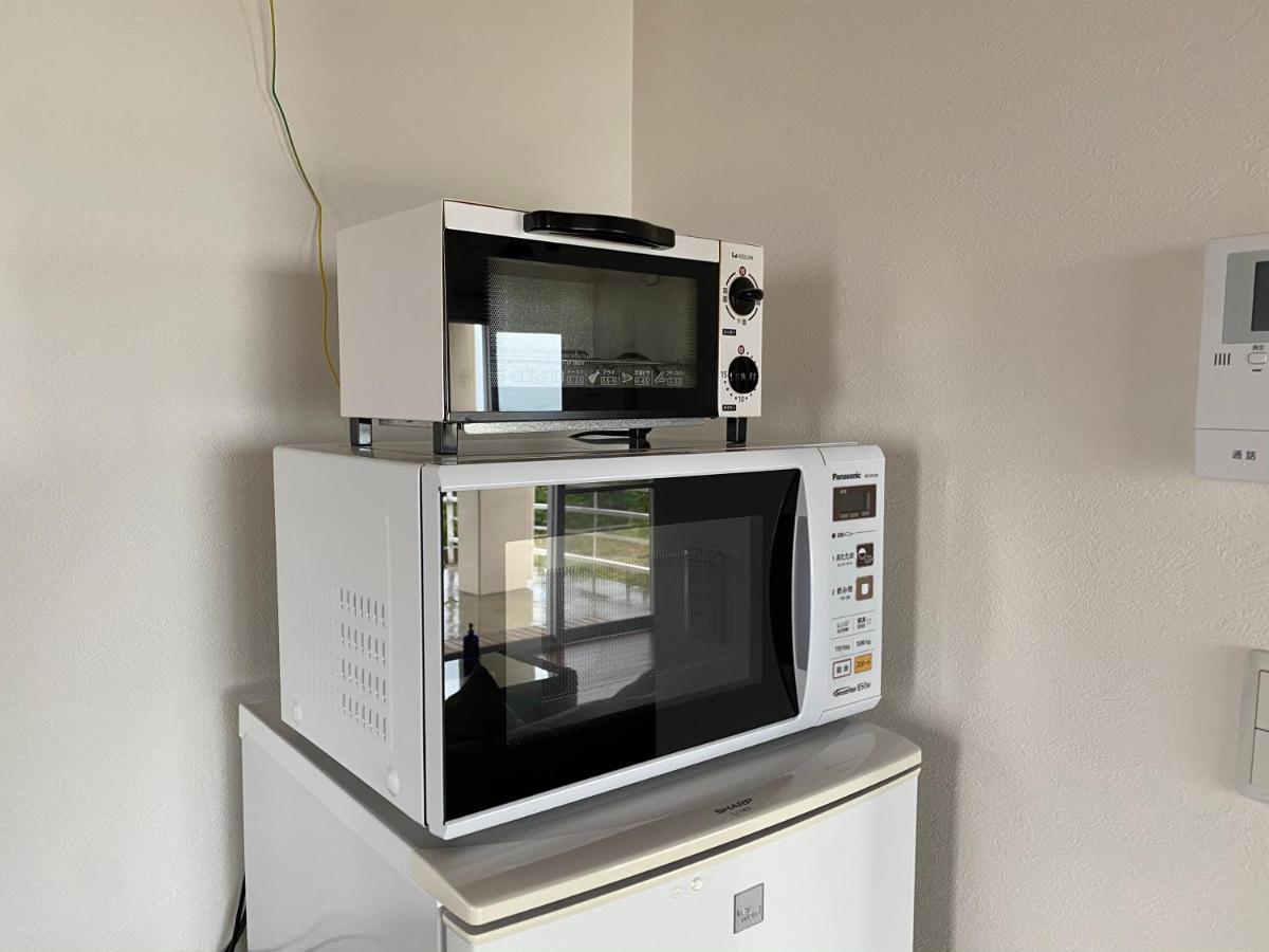 Apartamento Ocean Front Sumuide Nago Exterior foto